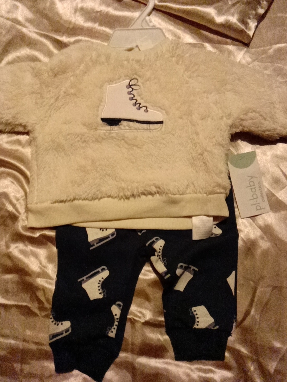 Girls Comfy Winter Outfit With Skate On The Shirt And Bottoms To Match.